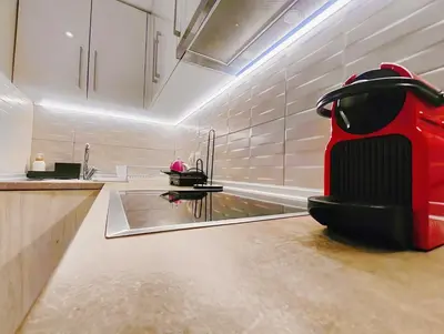 a kitchen with a red scooter sitting on the floor at CostaMare BoutiqueApart-where luxury meets comfort in Rhodes Town