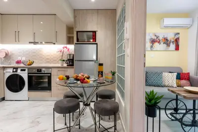 a kitchen with a table with fruit on it at CostaMare BoutiqueApart-where luxury meets comfort in Rhodes Town