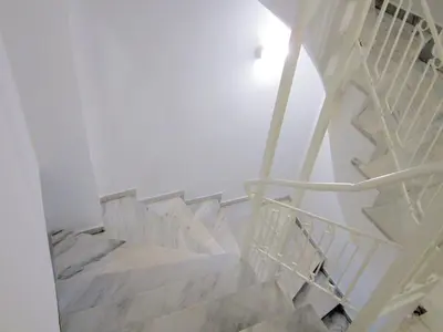 a staircase in a house with white walls at CostaMare BoutiqueApart-where luxury meets comfort in Rhodes Town
