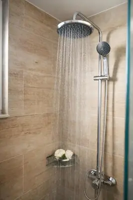 a shower with a shower head in a bathroom at Villa Almihauss - Adults Only in Afantou