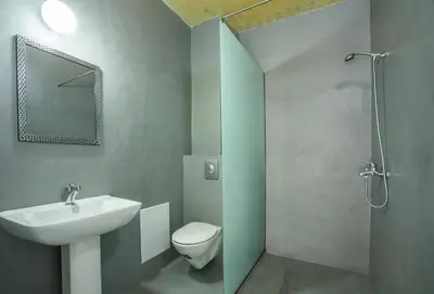 a bathroom with a sink and a toilet and a shower at Lisabeth Apartments in Faliraki