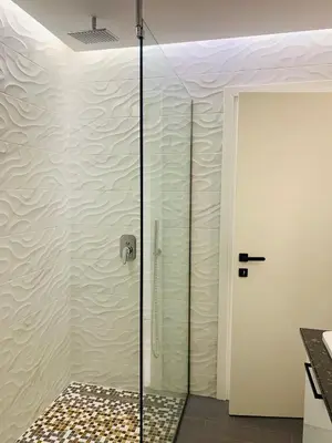 a shower with a glass door in a bathroom at Apartment Marla in Rhodes Town