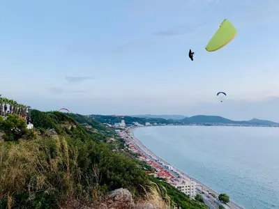 a kite flying over a beach and the ocean at Apartment Marla in Rhodes Town
