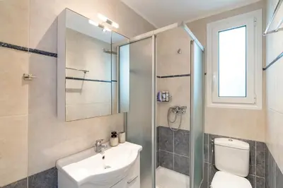 a bathroom with a toilet sink and a shower at Oasis in the Heart of Rhodes, next to Old Town, near Beaches - Haven Home in Rhodes Town