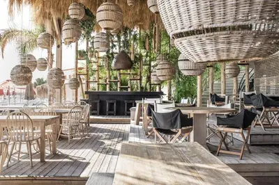 a restaurant with tables and chairs and a piano at Oasis in the Heart of Rhodes, next to Old Town, near Beaches - Haven Home in Rhodes Town