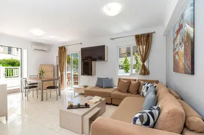 a living room with a couch and a table at Oasis in the Heart of Rhodes, next to Old Town, near Beaches - Haven Home in Rhodes Town