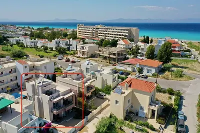 an aerial view of a city with houses and the ocean at Dionysus seaside villa in Ialyssos