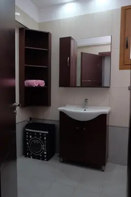 a bathroom with a sink and a mirror at Garden house in Kremasti