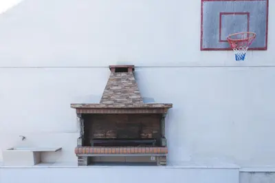 a basketball hoop on the side of a building at Garden house in Kremasti