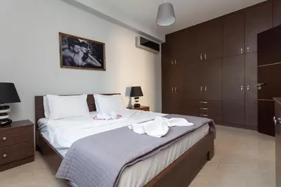 a bedroom with a bed with two towels on it at Garden house in Kremasti