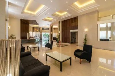 a living room with a couch and chairs and a table at Castellum Suites - All Inclusive in Rhodes Town