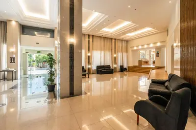 a lobby with couches and chairs in a building at Castellum Suites - All Inclusive in Rhodes Town