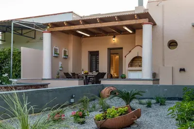 a house with a garden in front of it at Kolymbia memories house in Kolimbia