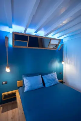 a blue bedroom with a bunk bed with a blue ceiling at Casa de Mikel in Rhodes Town