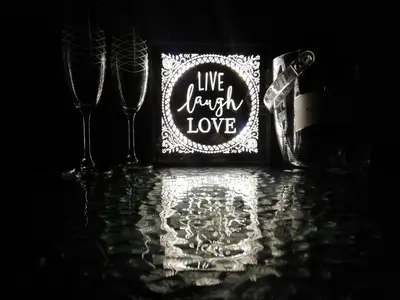 a picture of two wine glasses and a sign that says live happy love at Casa de Mikel in Rhodes Town