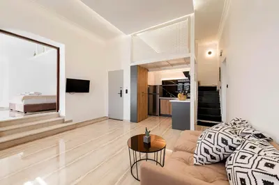 a living room with a couch and a table at Alia Apartments in Rhodes Town
