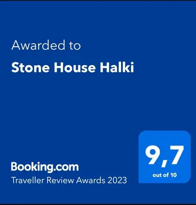 a screenshot of a stone house halik with the text awarded to stone house h at Stone House Halki in Halki