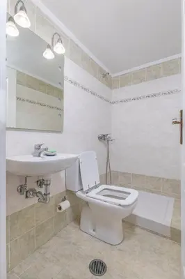 a bathroom with a toilet and a sink at 3- Sea view luxury suite in the center of Rhodes! in Rhodes Town