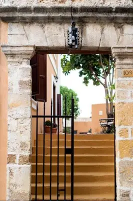 an entrance to a building with an iron gate at Kristina´s Apartments in Rhodes Town