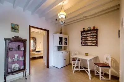 a room with a table and a table and chairs at Kristina´s Apartments in Rhodes Town