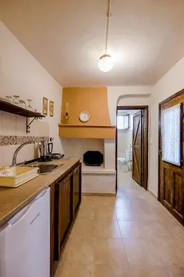 a kitchen with a sink and a counter top at Kristina´s Apartments in Rhodes Town