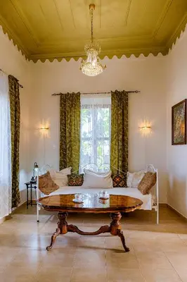 a living room with a couch and a table at Kristina´s Apartments in Rhodes Town