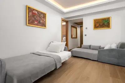a bedroom with a bed and a couch at Acandia Hotel in Rhodes Town