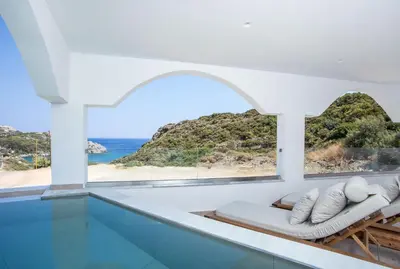 a room with a view of the ocean at Ladiko Suites - Faliraki in Faliraki