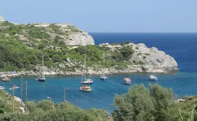 a group of boats are docked in a body of water at Ladiko Suites - Faliraki in Faliraki