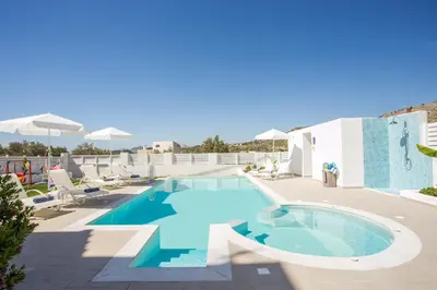 a swimming pool on the roof of a hotel at La Casa Del Amor in Kalithies