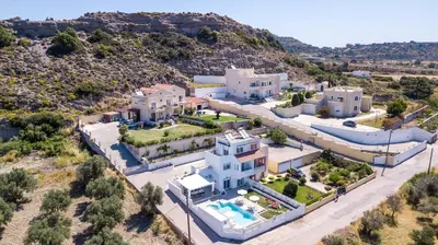 an aerial view of a large white house at La Casa Del Amor in Kalithies
