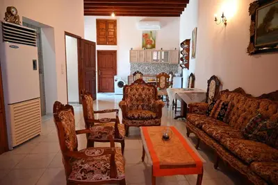 a living room with a couch and chairs and a table at Megiston House in Old Town Rhodes in Rhodes Town