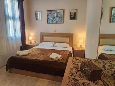 a bedroom with two beds with towels on them at Megiston House in Old Town Rhodes in Rhodes Town