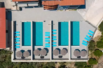 an overhead view of a building with blue roofs at Villa Divina in Kremasti