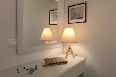 a table with two lamps on top of it at Kite Blue Villas in Kattavía