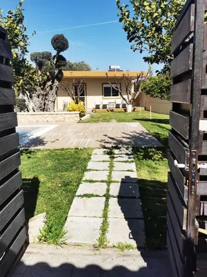 a walkway in front of a house at Villa MATA - 600m² with Private Pool and Jacuzzi in Kalithies