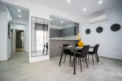 a dining room and kitchen with a table and chairs at Rodini House in Rhodes Town