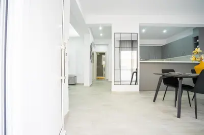 a kitchen and dining room with a table and chairs at Rodini House in Rhodes Town