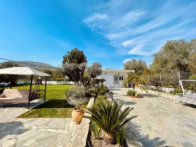a patio with a gazebo and some plants at Archangelos Garden House in Archangelos