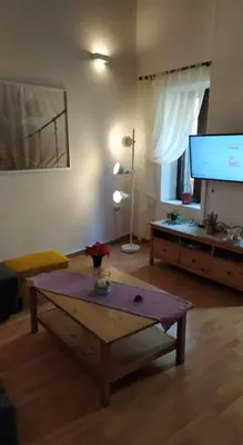 a living room with a coffee table and a flat screen tv at Niochori apartments 1 in Rhodes Town