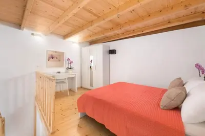 a bedroom with a bed and a desk in it at Niochori apartments 1 in Rhodes Town