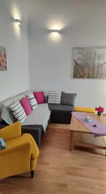 a living room with a couch and a coffee table at Niochori apartments 1 in Rhodes Town