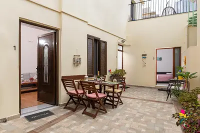a dining room with a table and chairs at Niochori apartments 3 in Rhodes Town