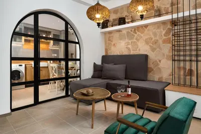 a living room with a couch and a table at Legato House in Rhodes Town