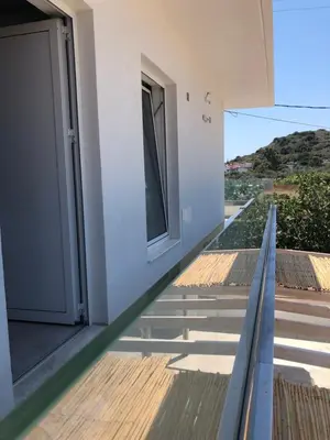 a stairway leading up to a building with a door at Oliva in Faliraki