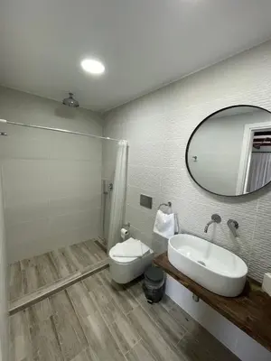 a bathroom with a sink and a mirror at Oliva in Faliraki