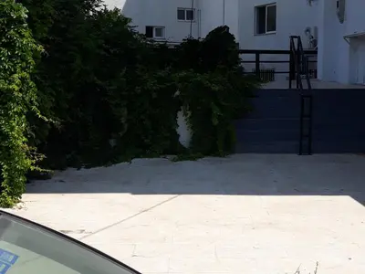 a car parked in front of a house at AS ALESIAS SUITES.Room 12. in Rhodes Town