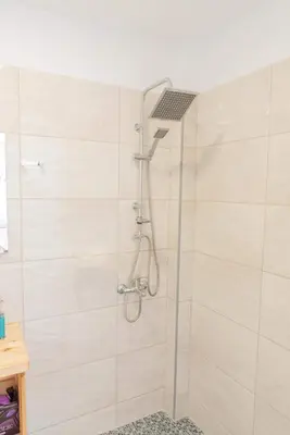 a shower with a shower head in a bathroom at AS ALESIAS SUITES.Room 12. in Rhodes Town