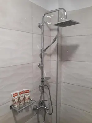 a shower in a bathroom with a glass wall at AS ALESIAS SUITES.Room 12. in Rhodes Town