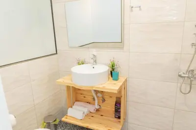 a bathroom with a sink and a shower at AS ALESIAS SUITES.Room 12. in Rhodes Town